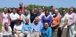 Over twenty men and women outside