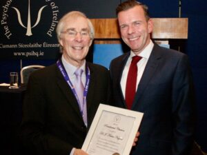 Dr. Kevin Nugent giving a man an award