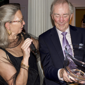 Kevin Nugent and Lise Johnson holding an award